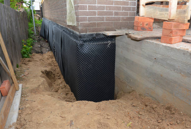 Happy homeowners after waterproofing job in Byron Center